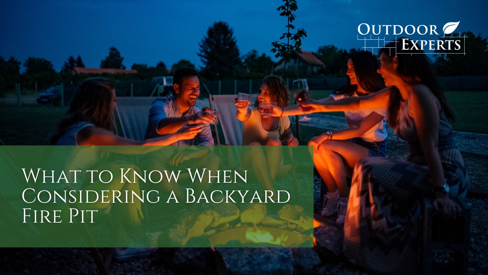 people cheering drinks while sitting around a campfire